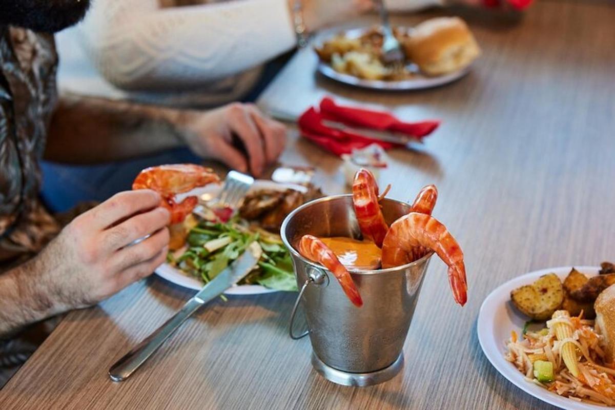 a person sitting at a table with a plate of food