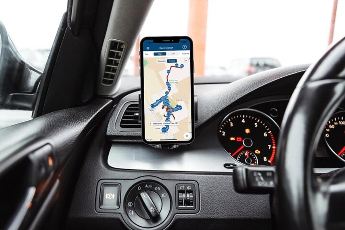 a cell phone sitting on the dashboard of a car