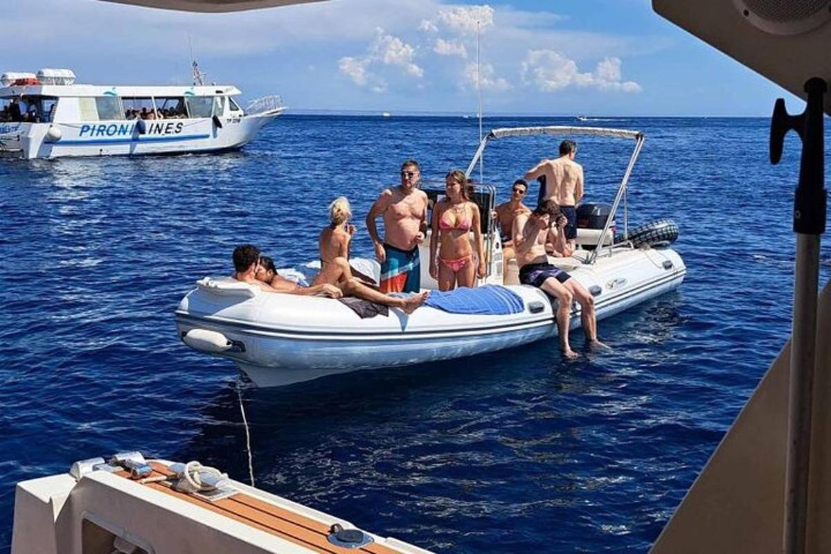 a group of people on a boat in the water