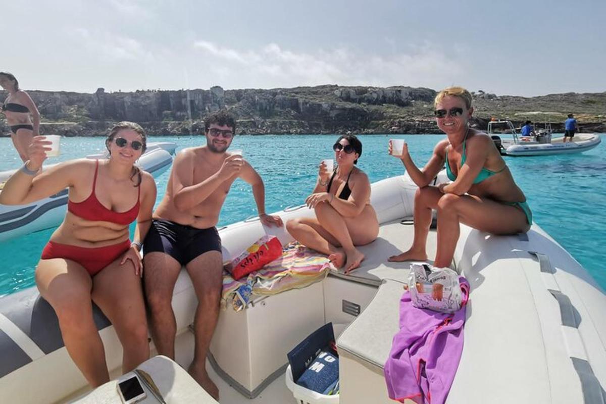 a group of people sitting on a boat in the water