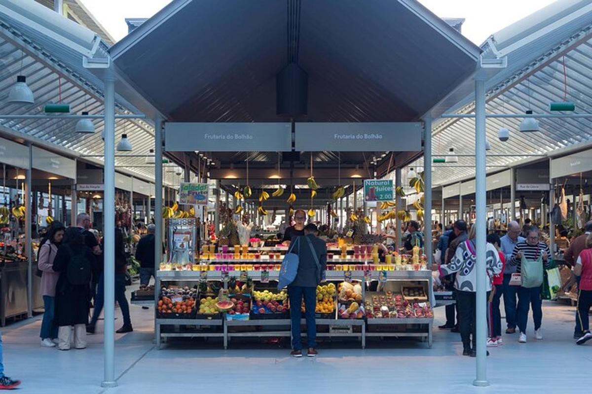 a group of people walking around a produce market