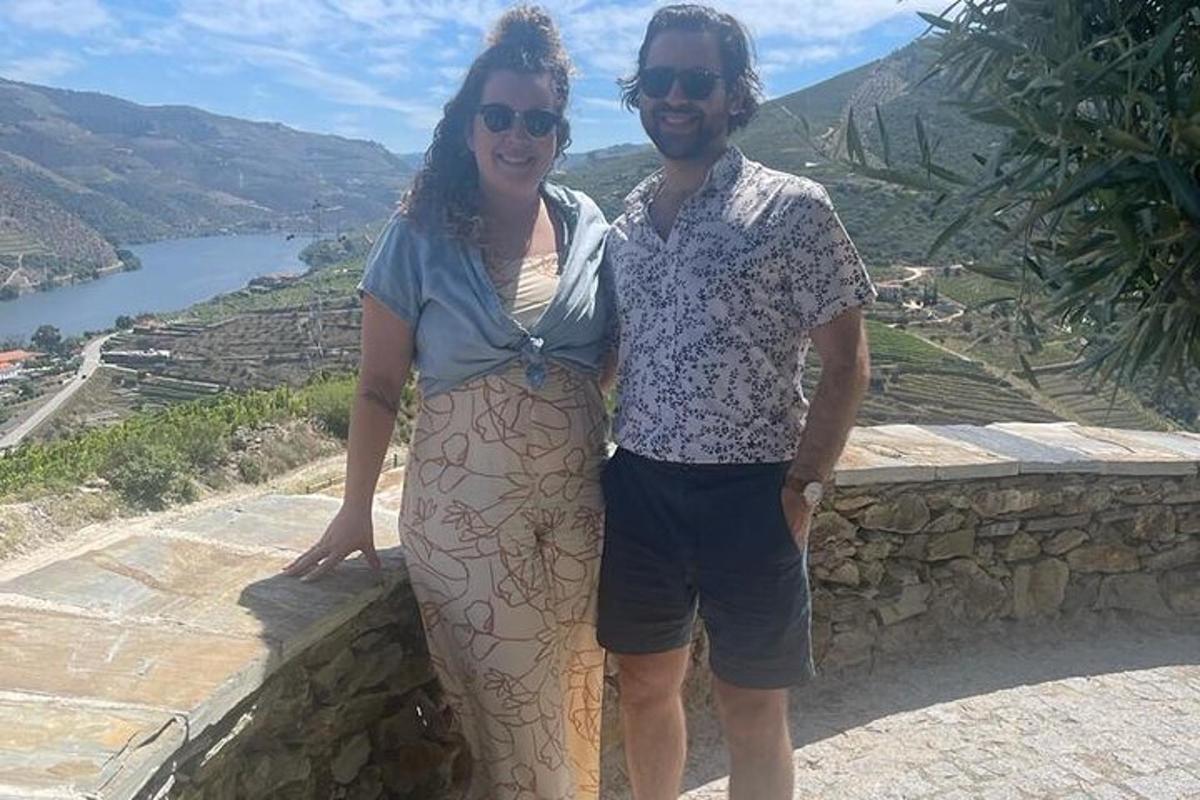 a man and a woman standing on a wall