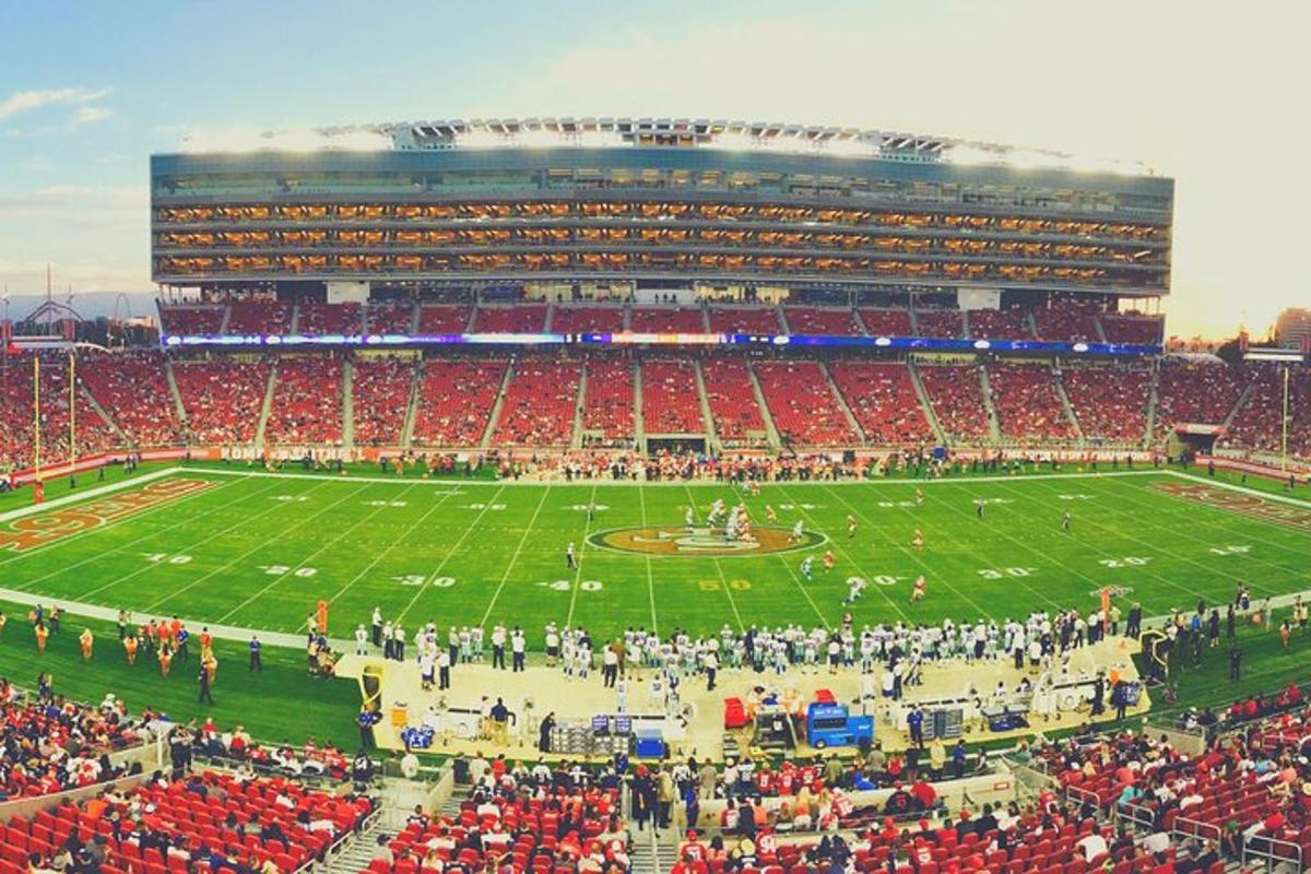 an aerial view of a football game in a stadium