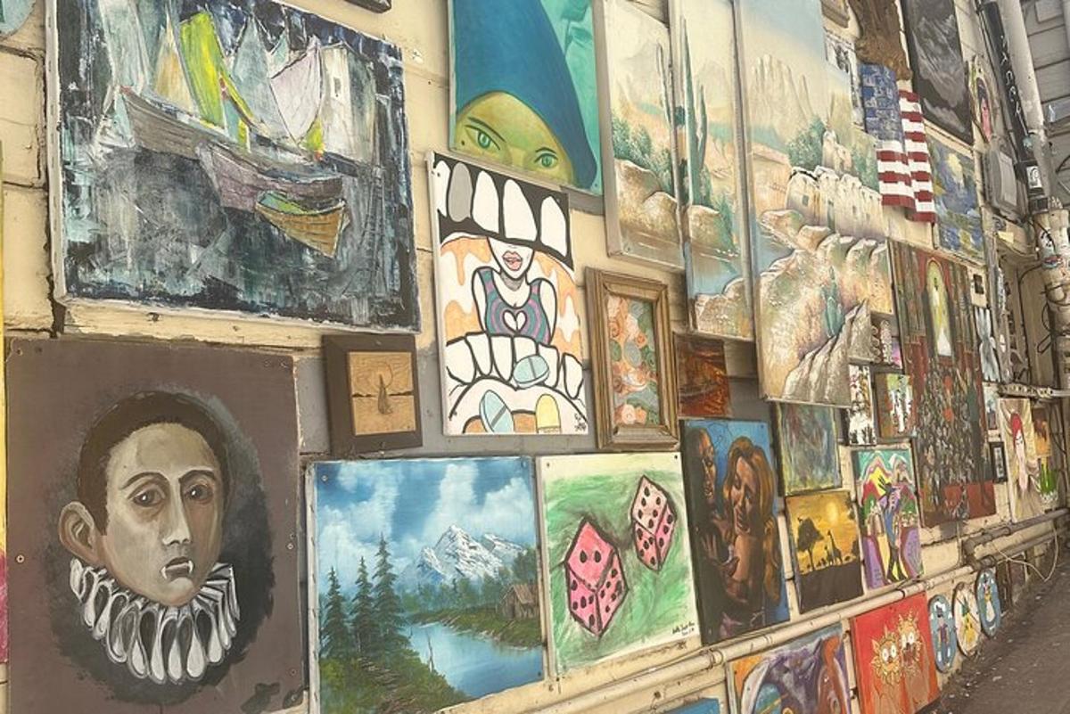 a wall with paintings and pictures on it