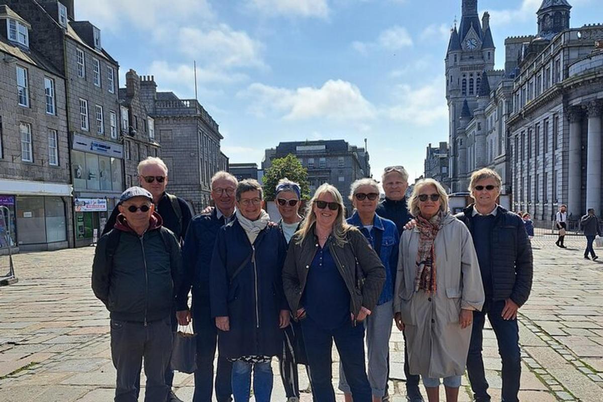 a group of people posing for a picture in a city