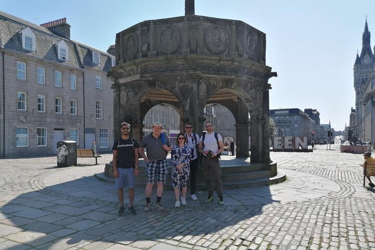 a group of people standing in front of an arch