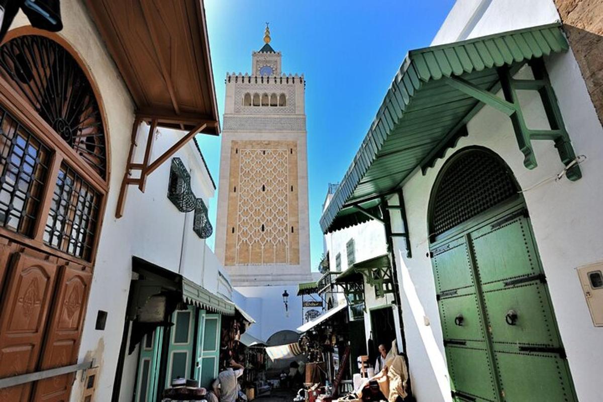 a clock tower in the middle of a street