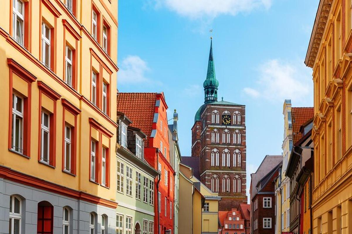 a city street with a clock tower and buildings