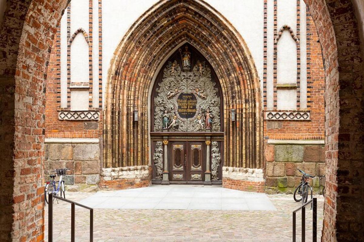 an entrance to a building with a large wooden door