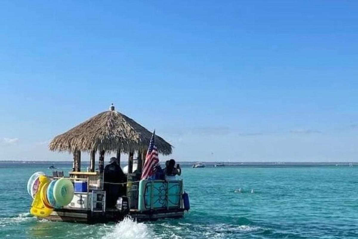 a group of people on a boat in the water
