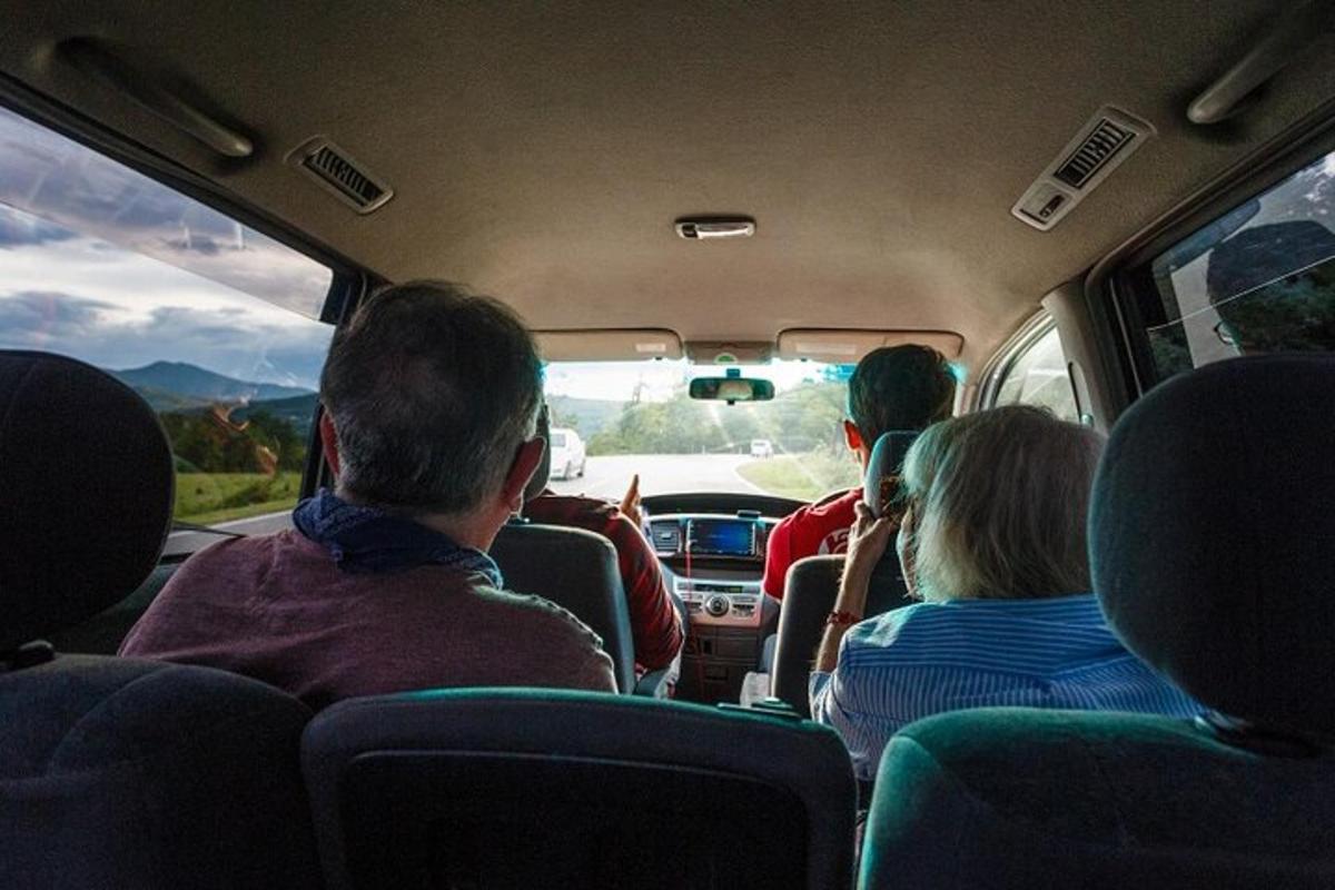 a group of people sitting in the back of a bus
