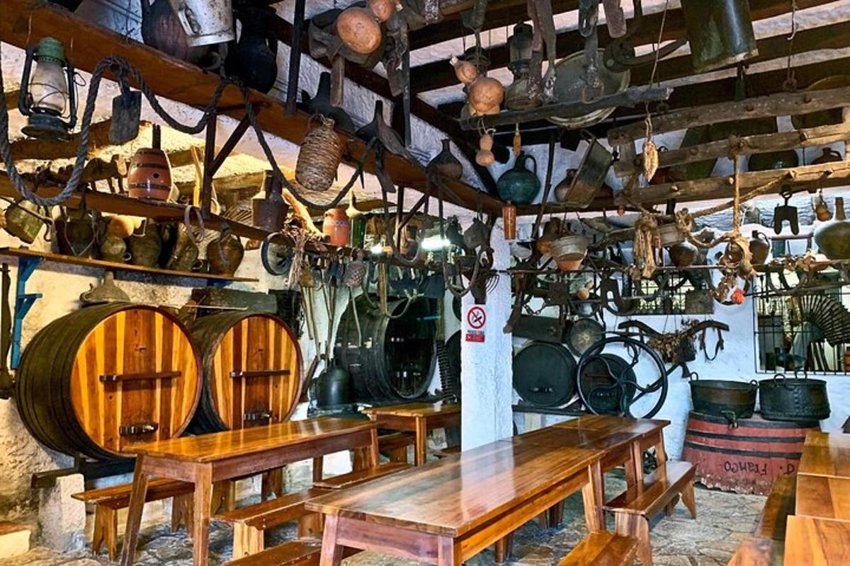 a room with wooden tables and lots of pots and pans