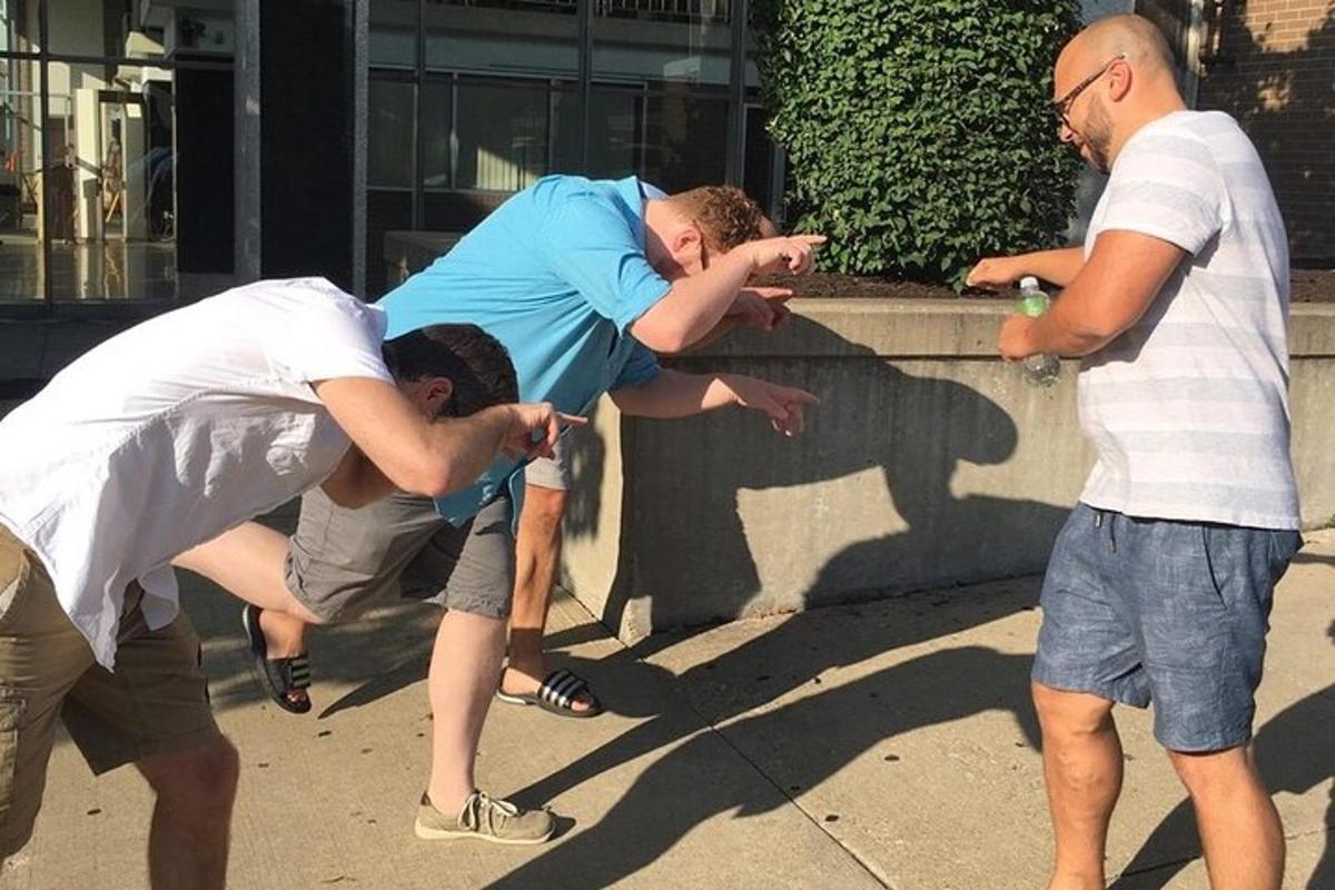 a group of men playing a game on a sidewalk