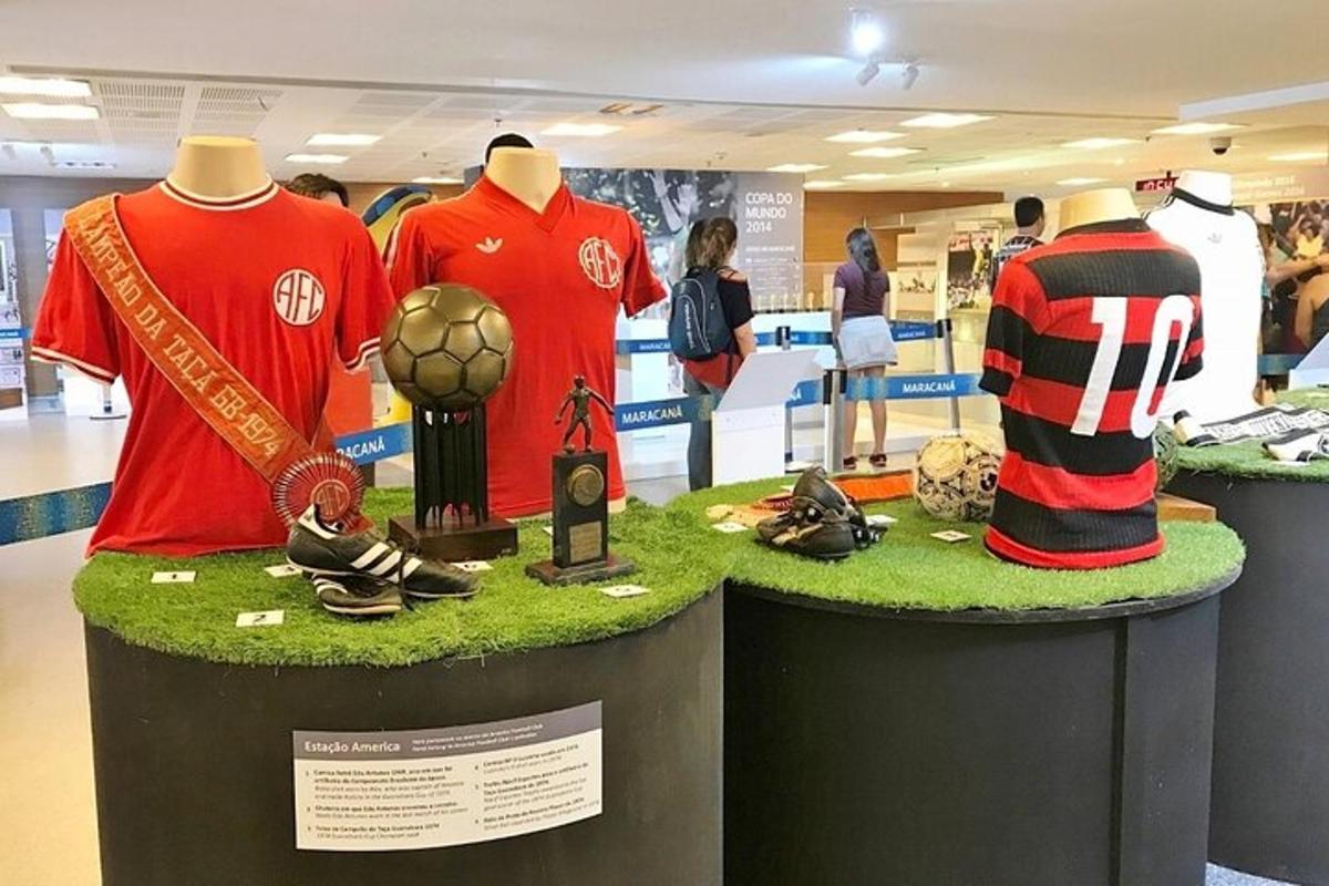 a display of soccer jerseys and shoes on display in a store