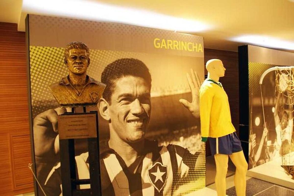 a display of a mannequins and a statue of a player