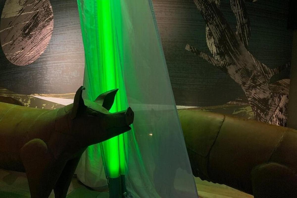 a green light on a curtain in a room