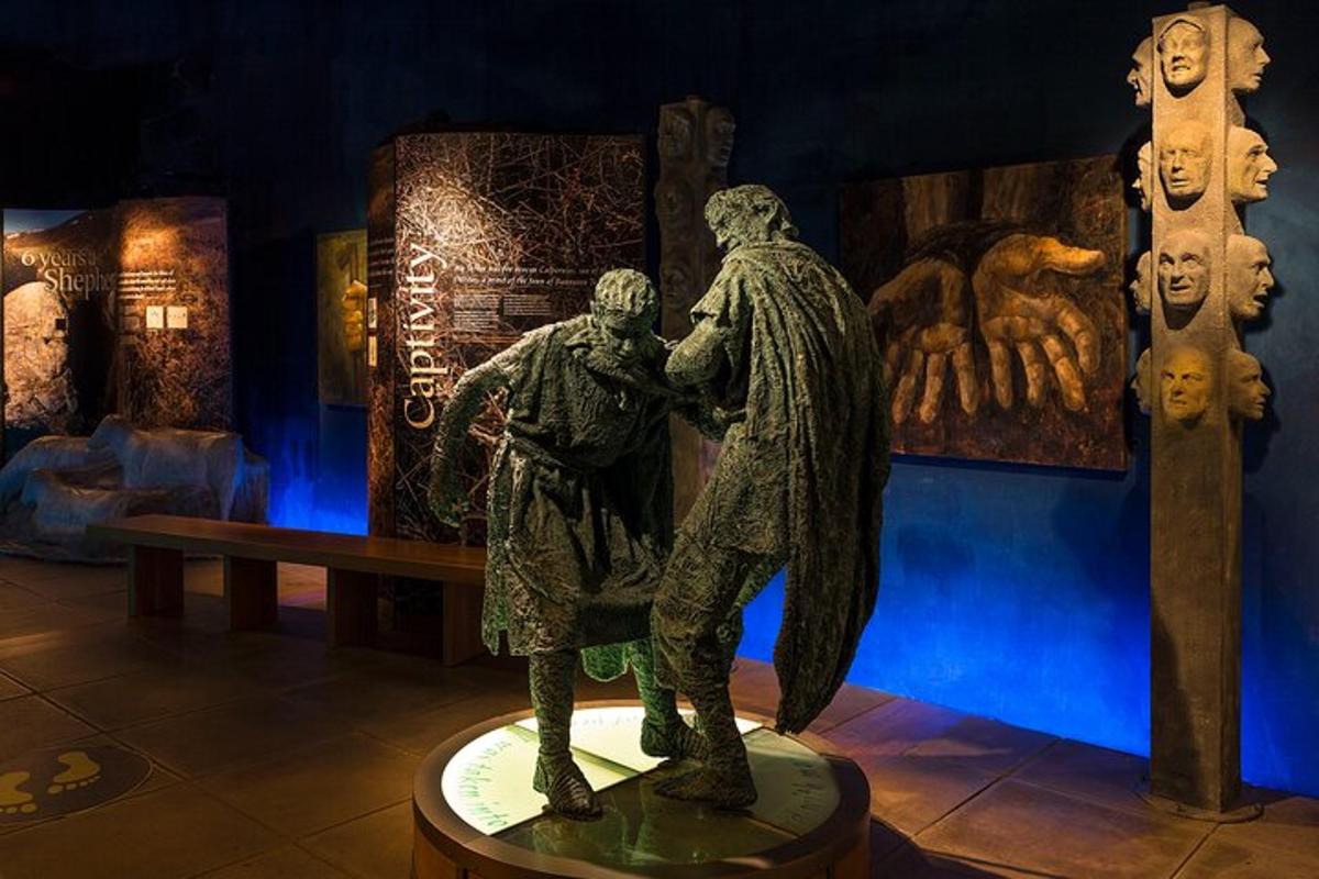 a statue of a man and a woman in a museum