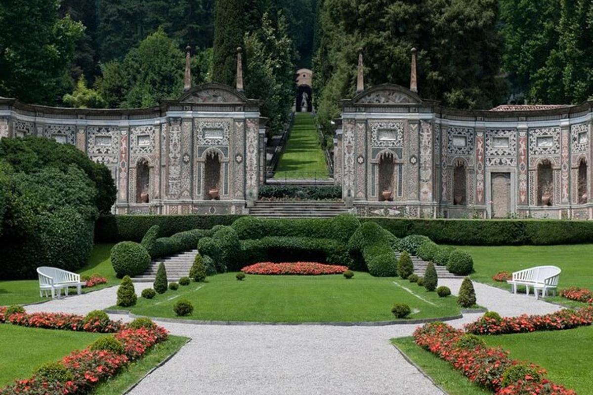 an ornate building with a garden in front of it