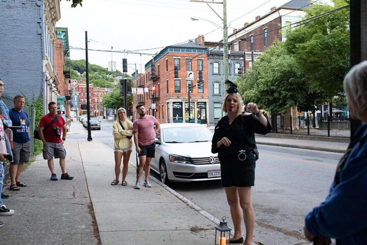 a group of people standing on a sidewalk