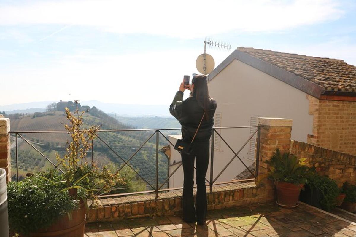 a statue of a man standing on top of a balcony