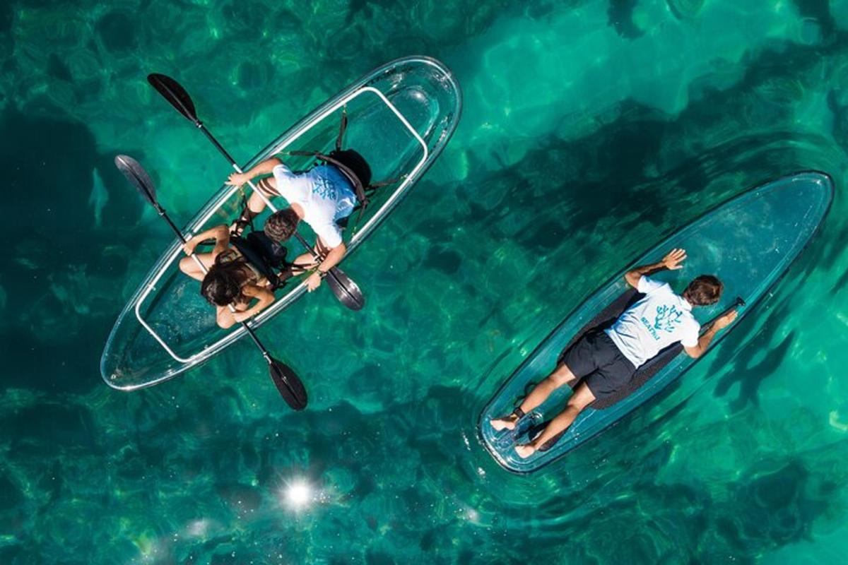 two people riding on a paddle board in the water