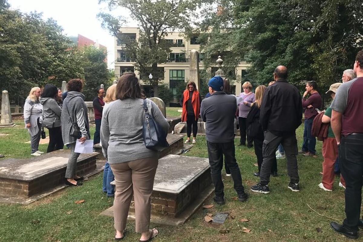 a group of people standing around in a park