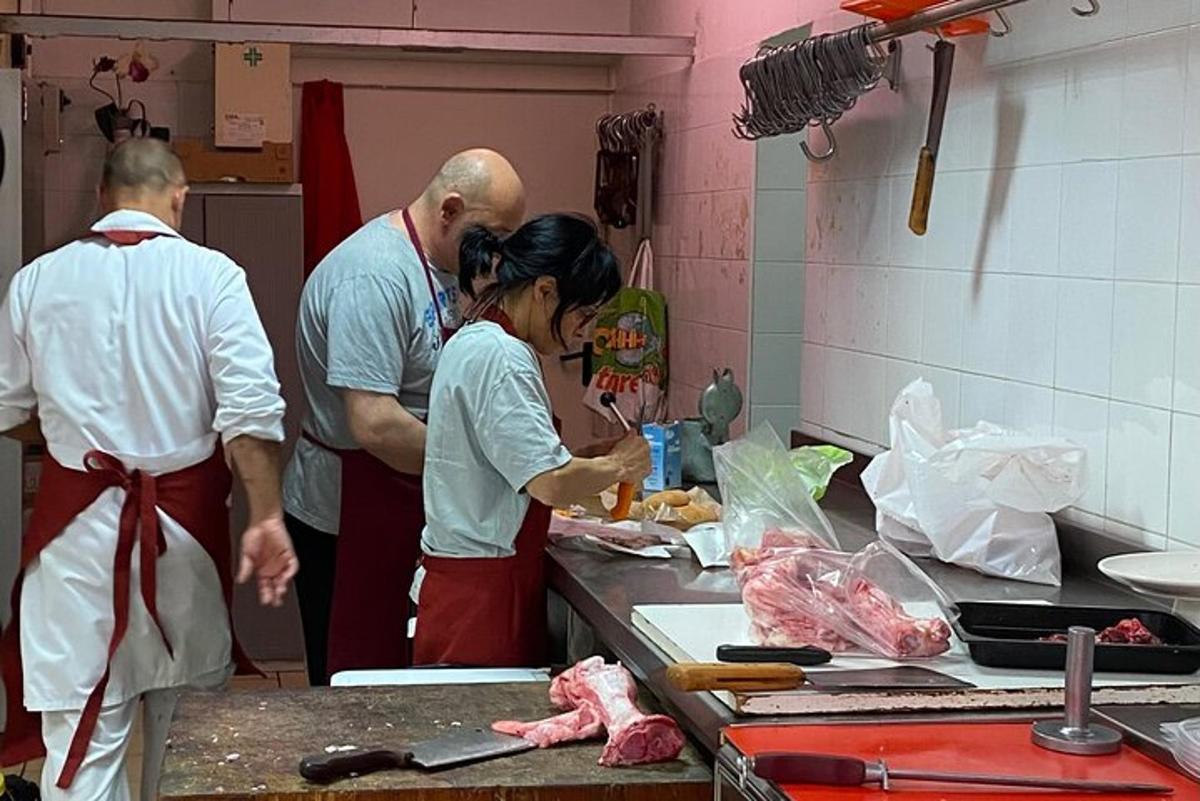 a group of people in a kitchen preparing food