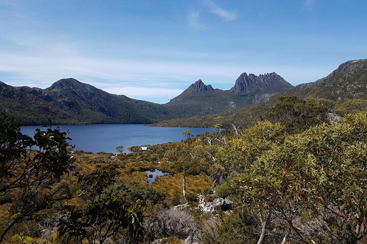 a view of a lake in the middle of a mountain