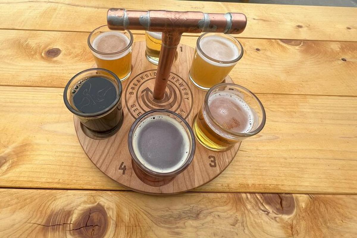 a tray of beer glasses on a wooden table