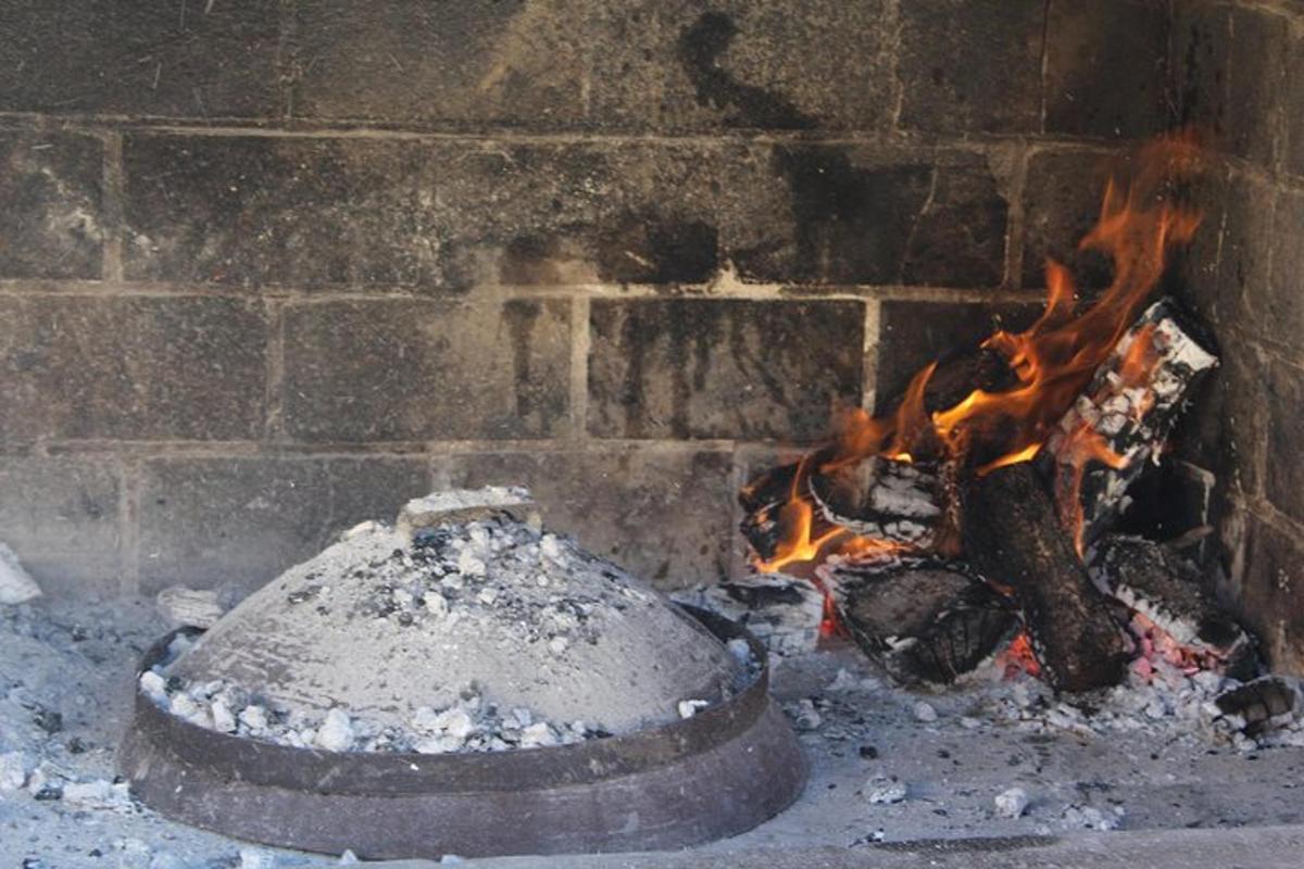 a brick oven with a fire inside of it