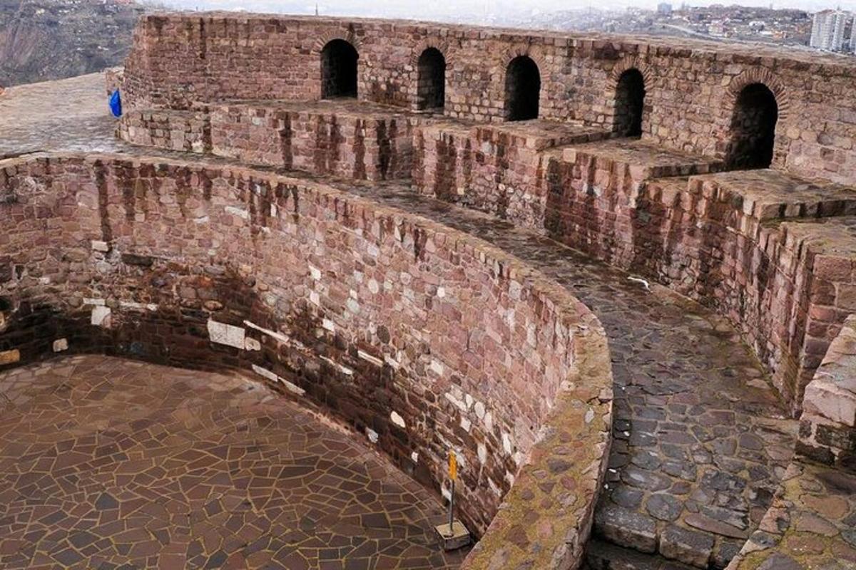 an old brick building with arches on top of it