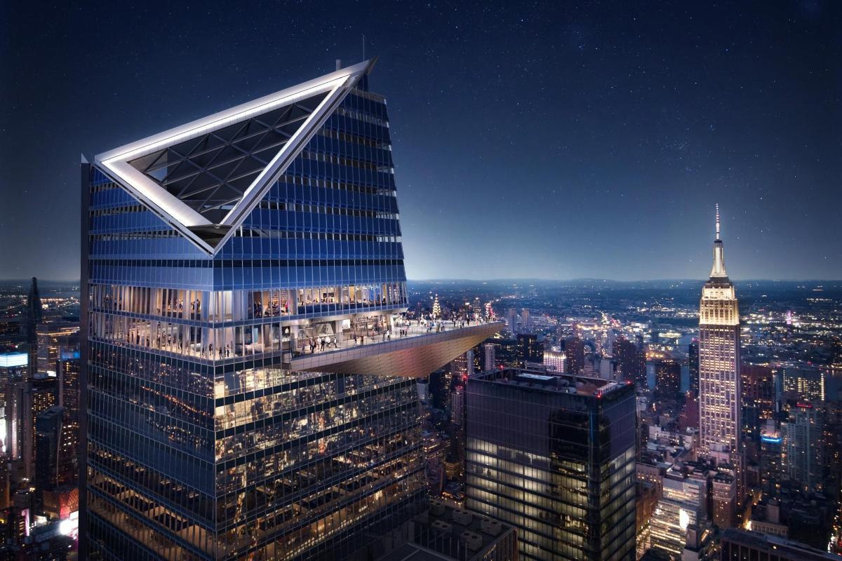 a tall skyscraper with a view of the city