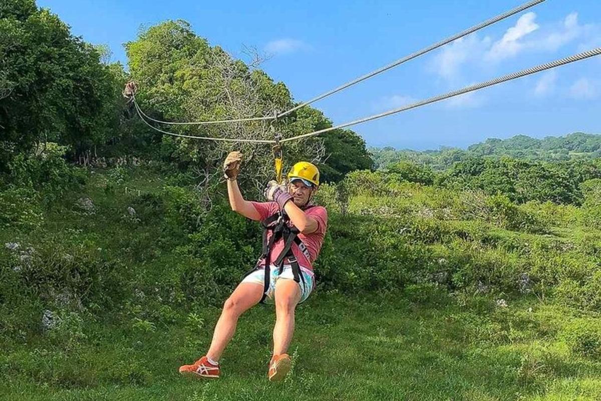 a woman is on a zip line