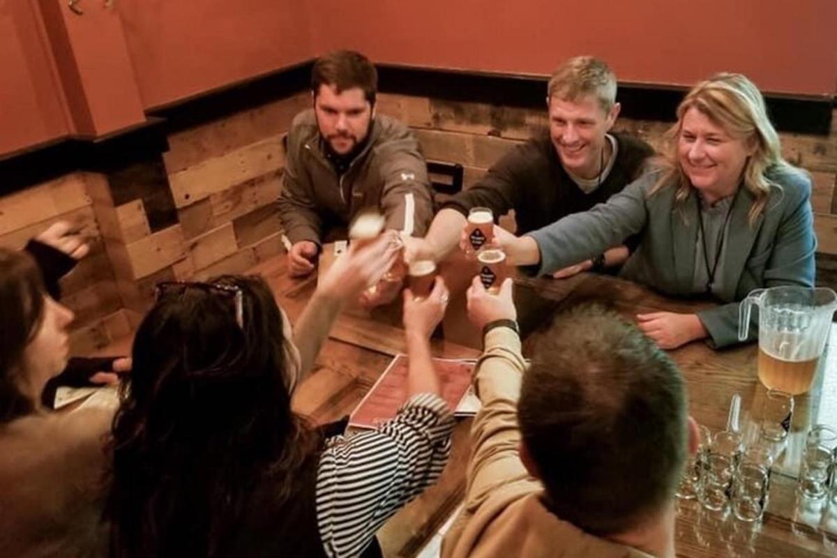 a group of people sitting around a table with drinks