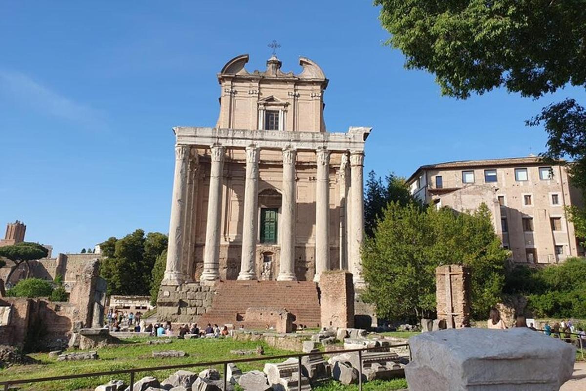 a building with a tower in the middle of a cemetery