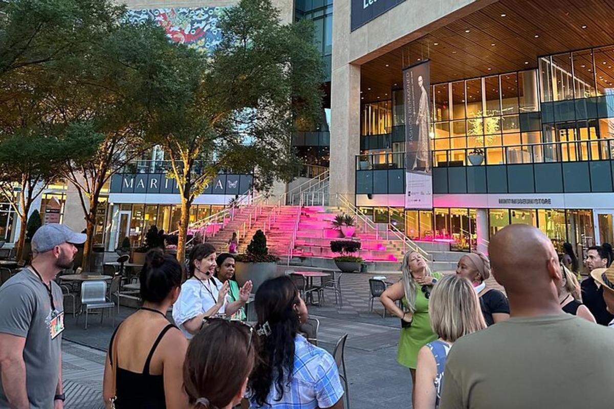 a crowd of people standing in front of a building