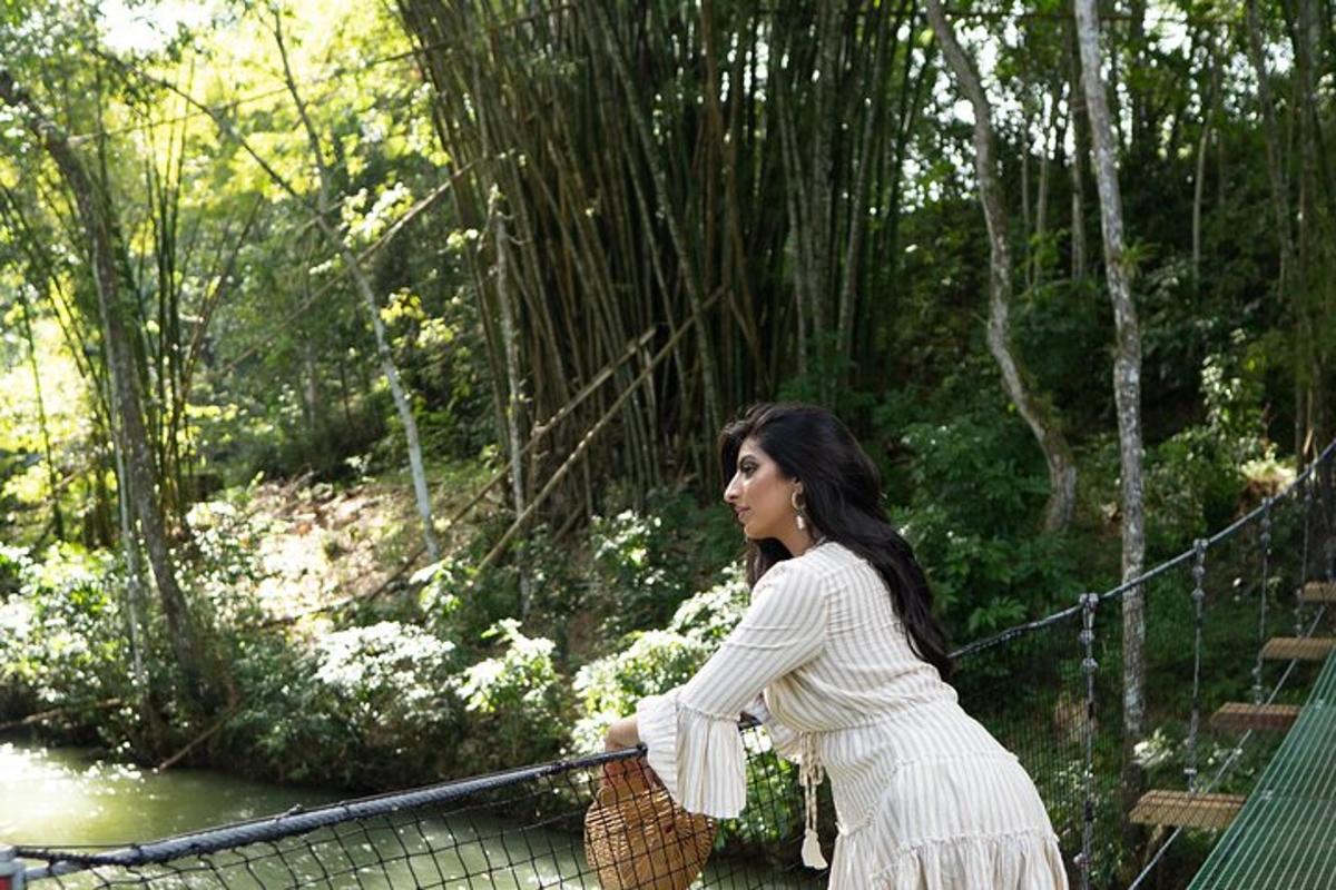 a woman crossing a suspension bridge in a forest