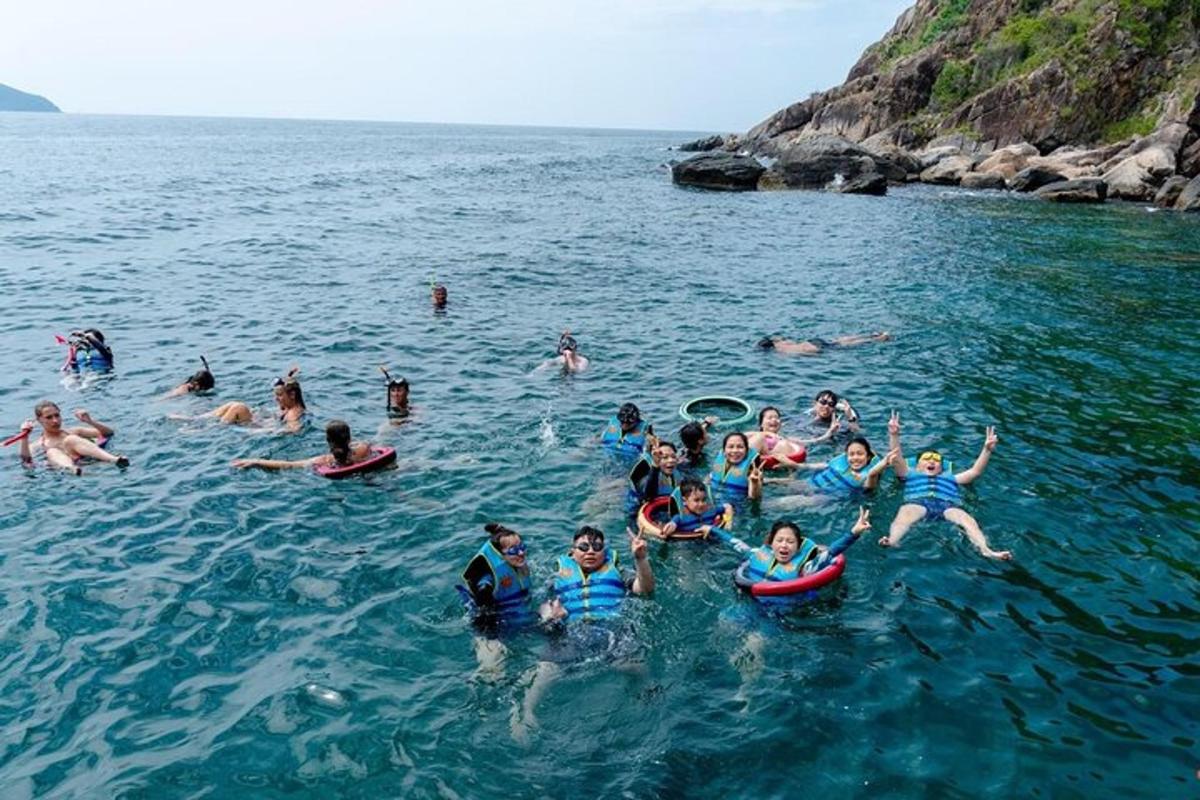 a group of people swimming in the water