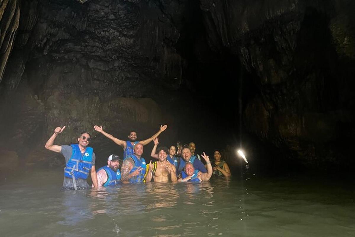 a group of people standing in the water