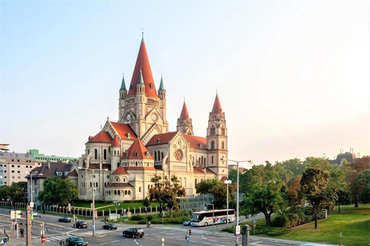 a large building with towers on a city street