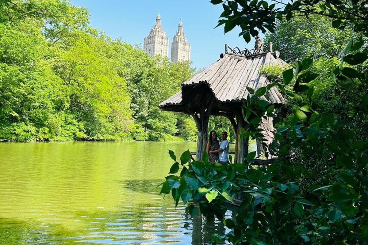 a group of people standing in a gazebo in the water