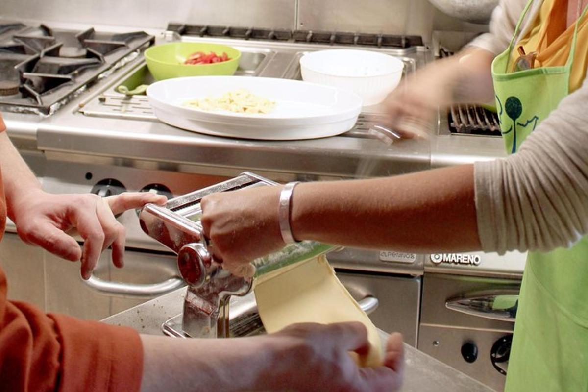 a group of people in a kitchen preparing food
