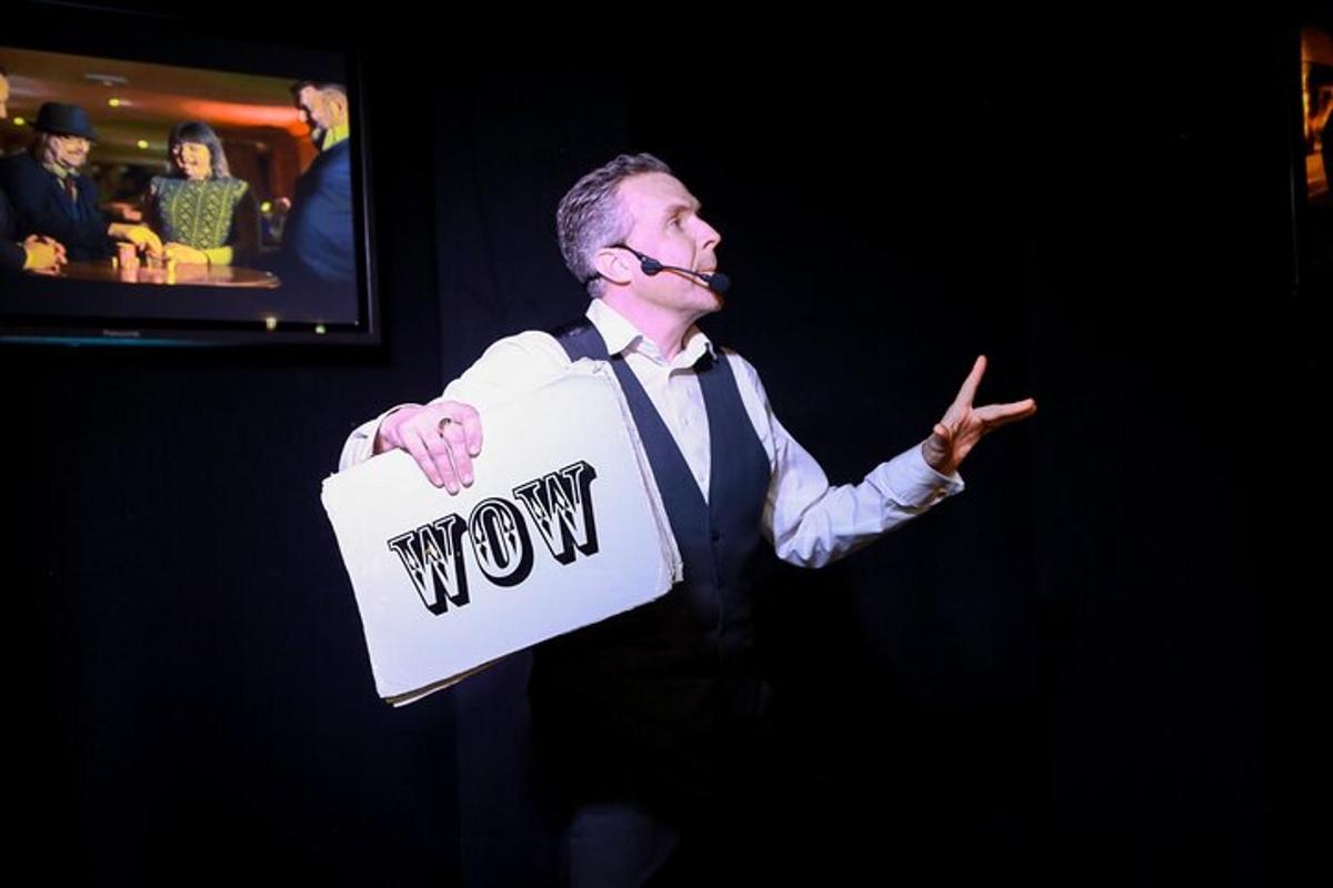 a man holding a sign with the word wow