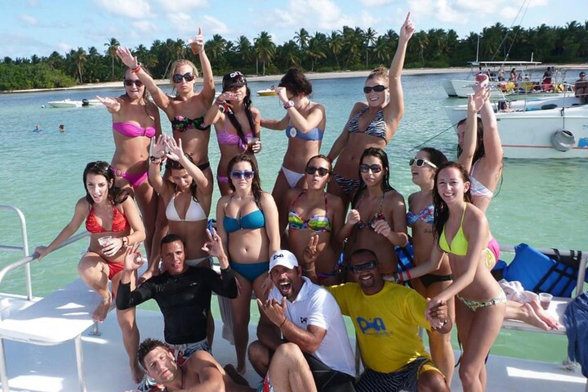 a group of people in bathing suits on a boat