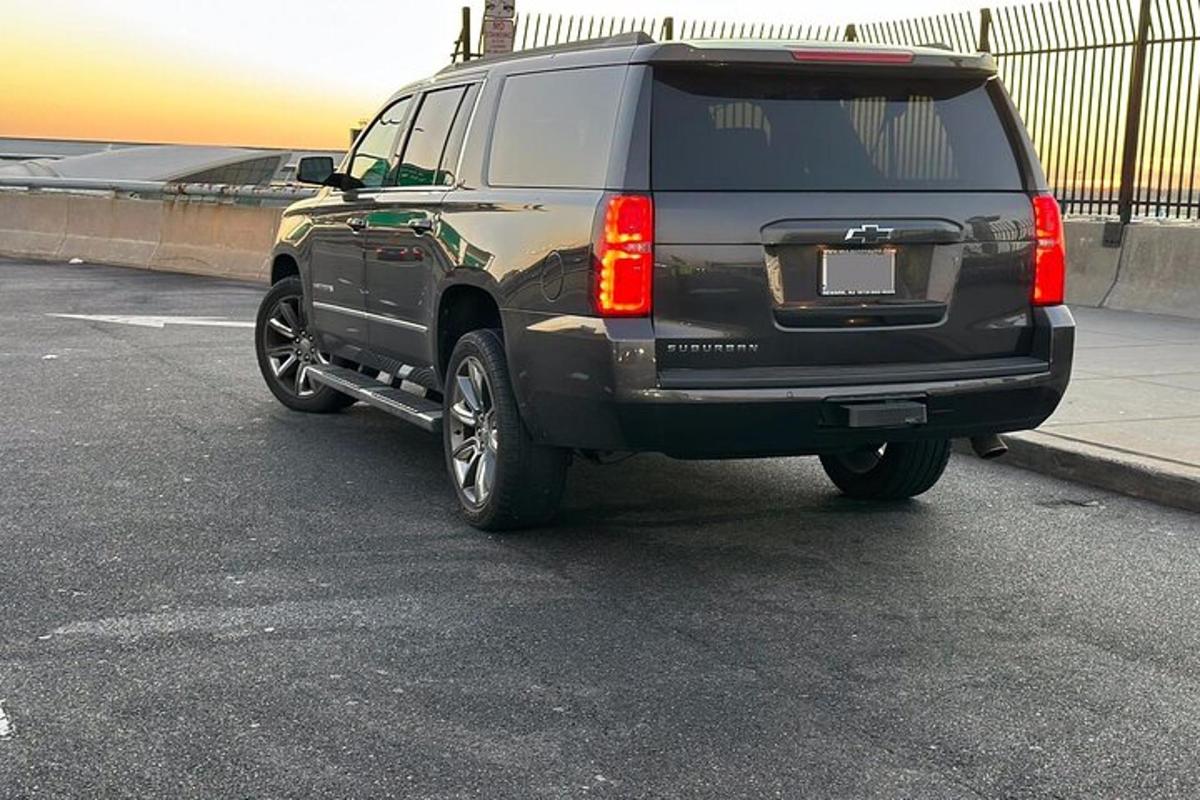 a black suv parked in a parking lot