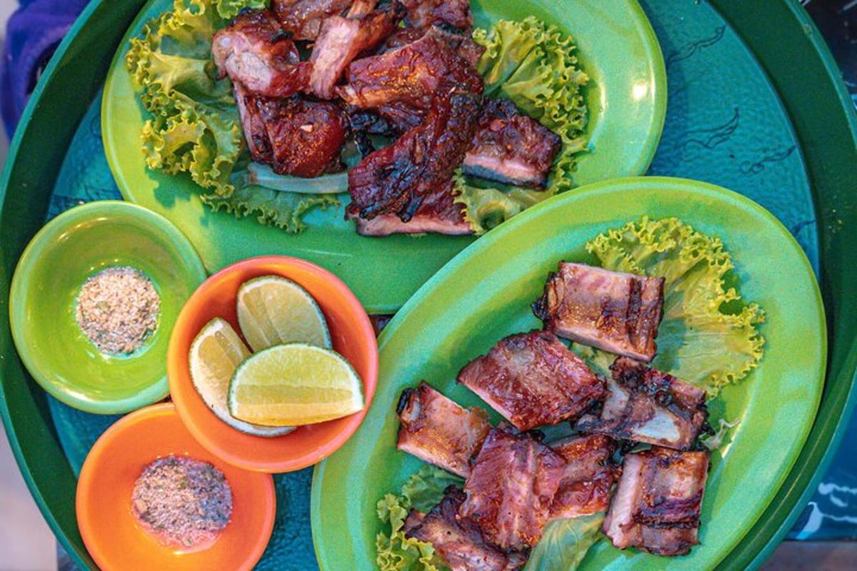 two green plates of food with meat and lettuce