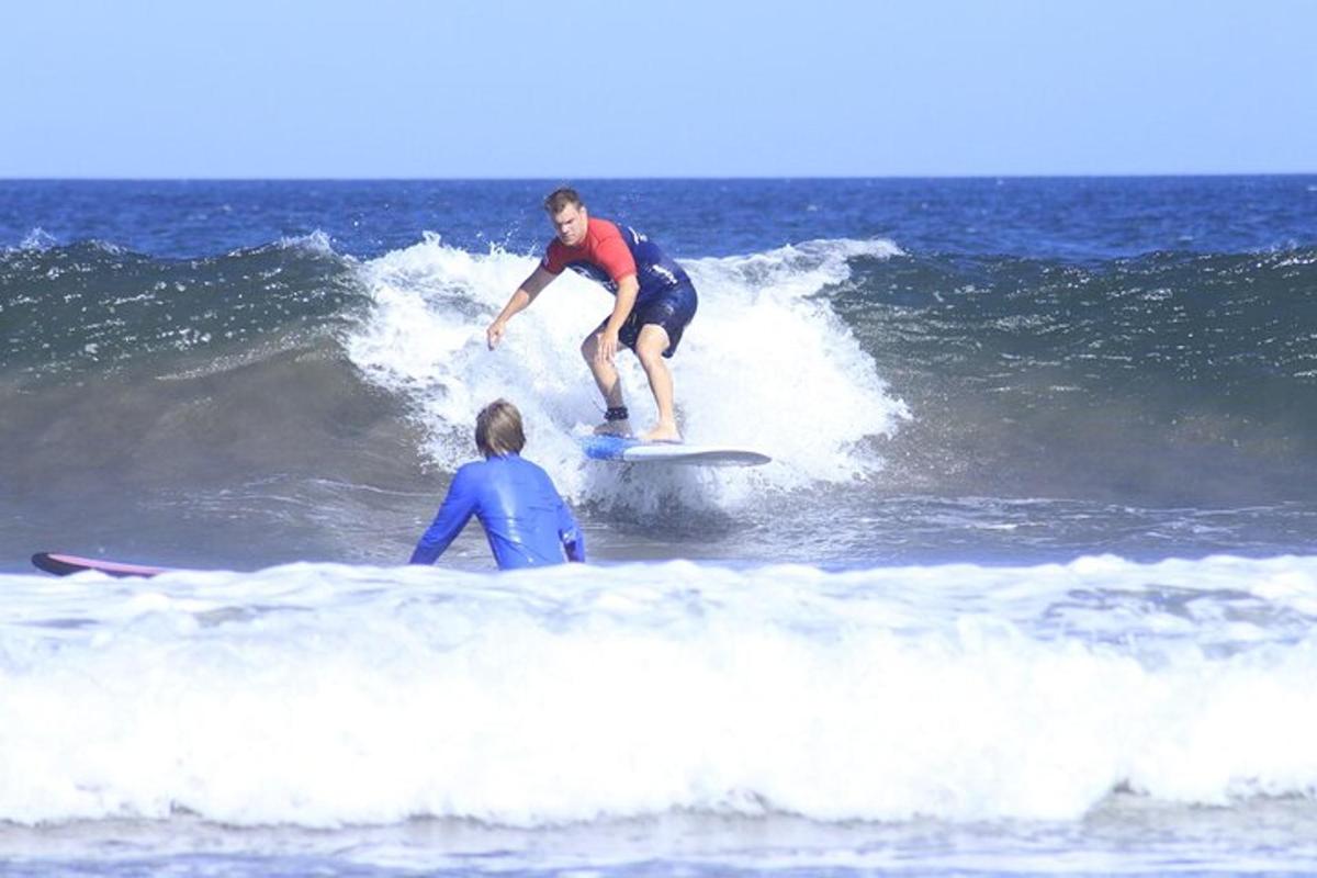 a man riding a wave on a surfboard in the ocean