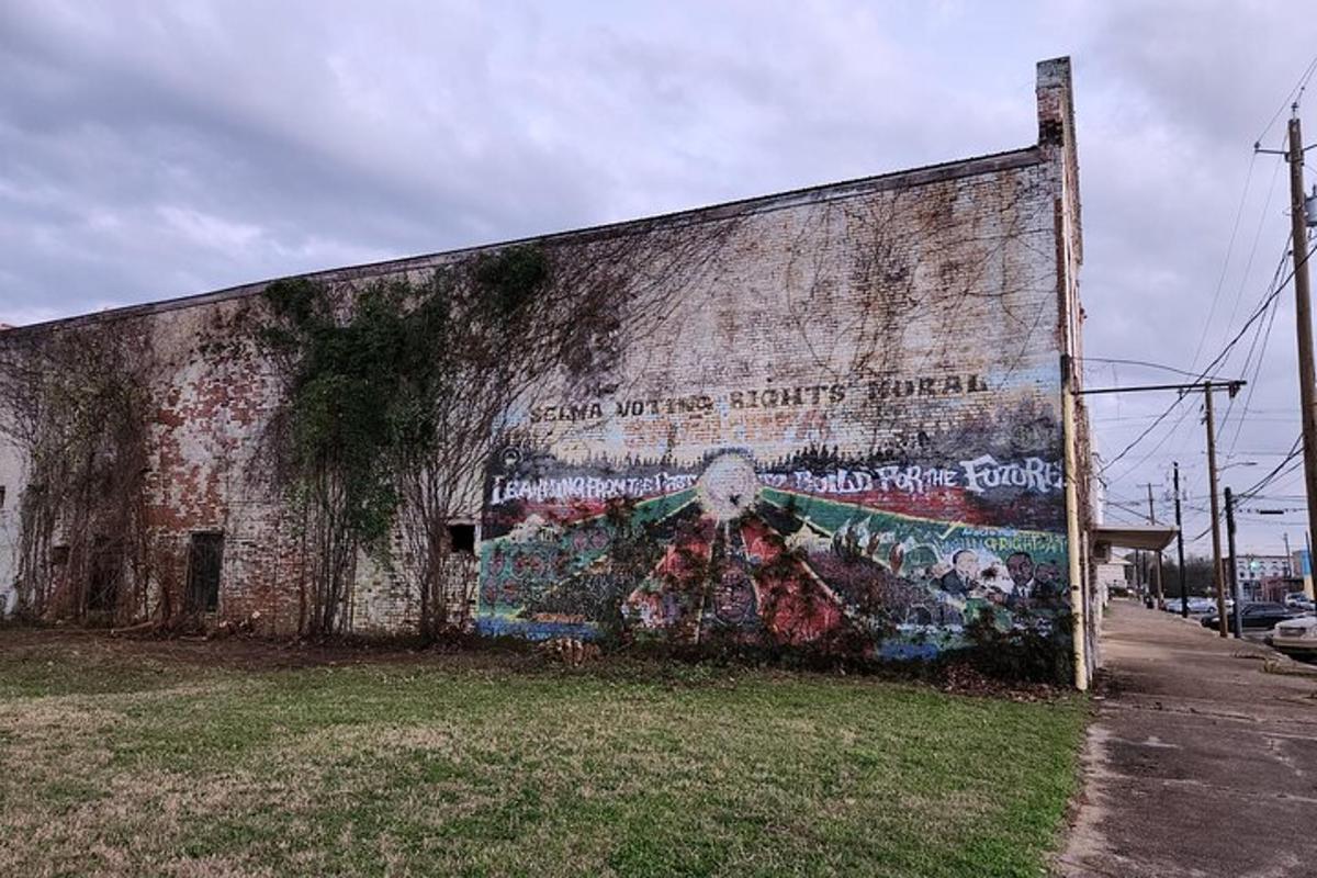 an old building with a mural on the side of it