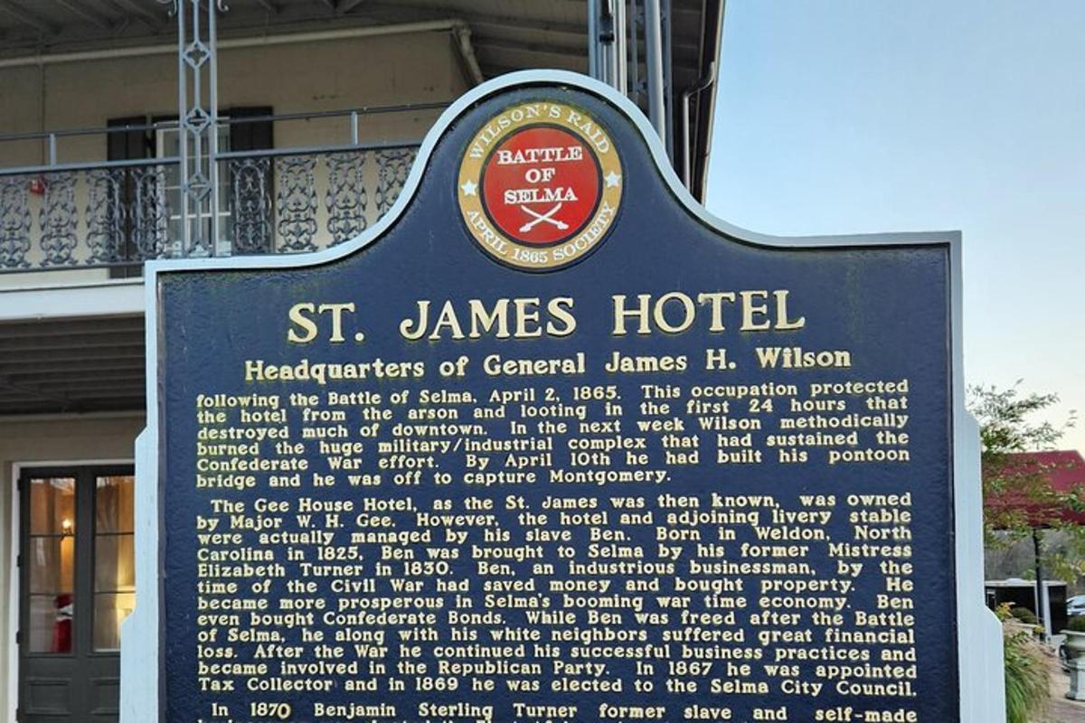 a sign for a st james hotel in front of a building
