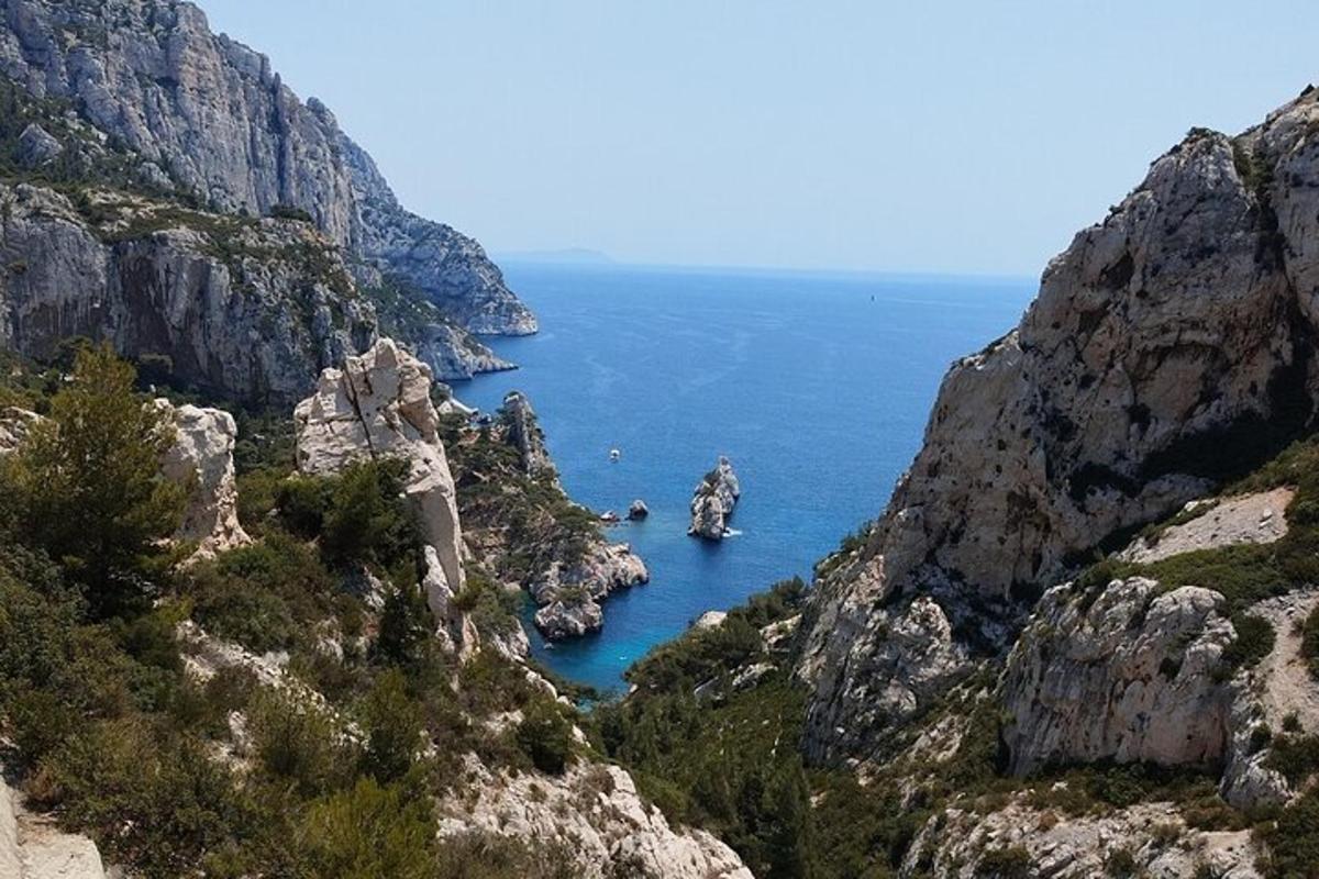 a view of the ocean from a mountain cliff